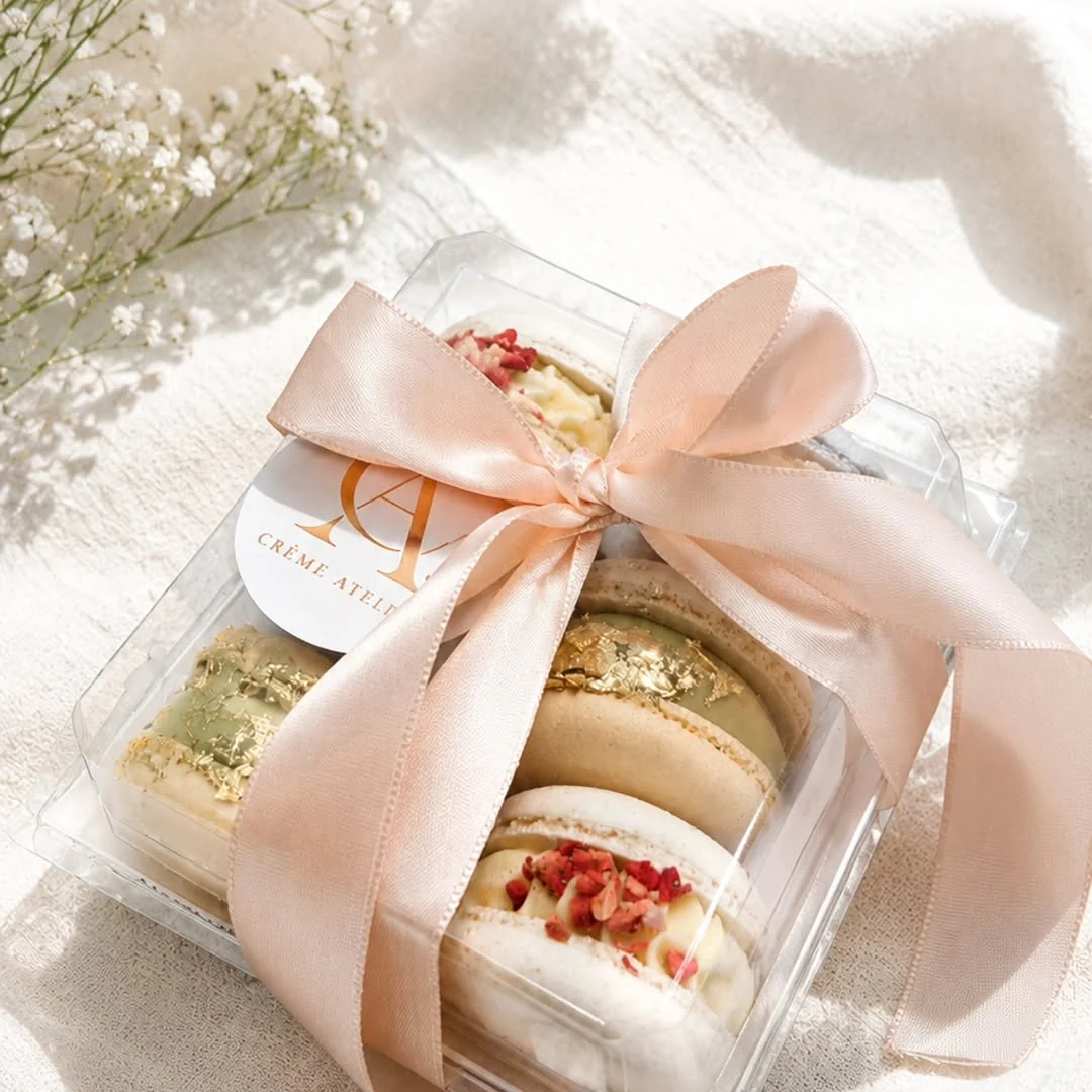 Macaron gift box tied with a blush ribbon